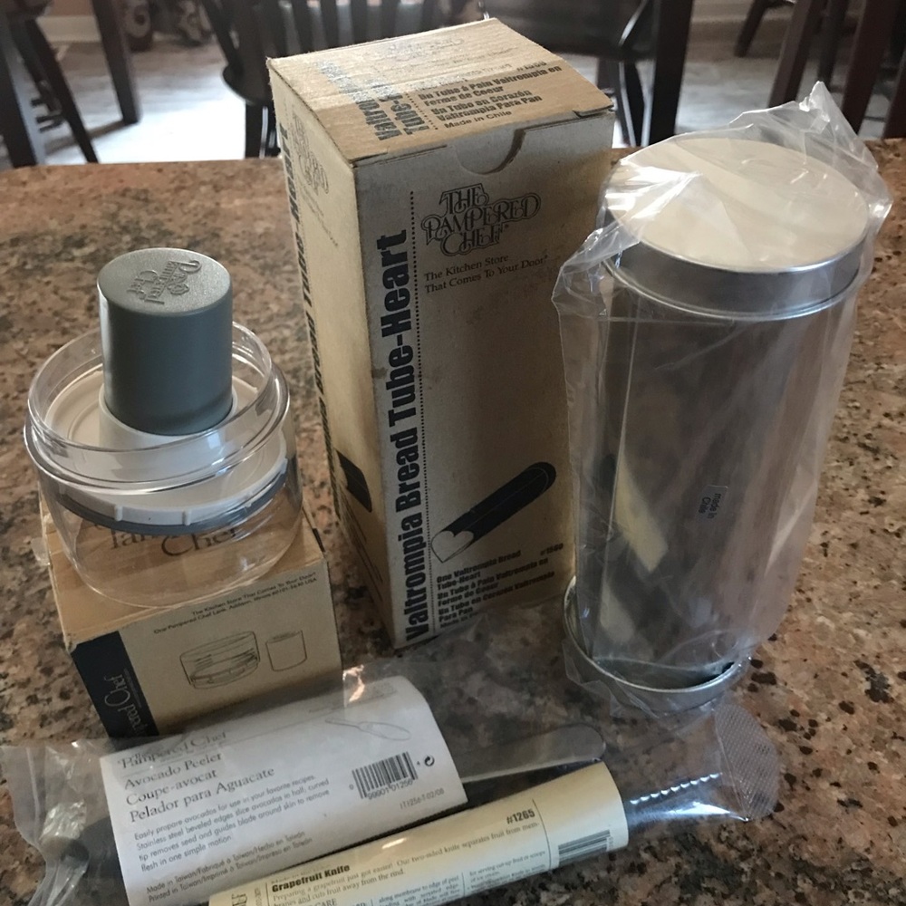 Pampered chef heart bread tube,ice cream maker,avocado peeler,grapefruit knife